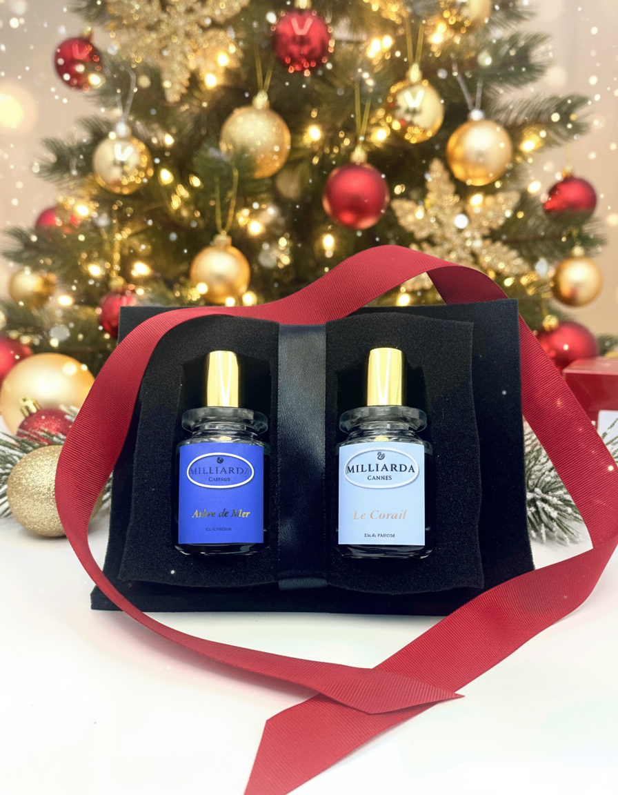 Two Milliarda Cannes 30ml parfums, Le Corail & Arbre de Mer in a black insert on a festive background