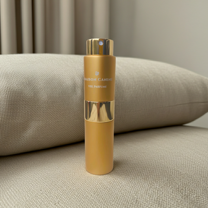 Maison Canine Veil Parfumé Mini gold perfume bottle for dogs on light cushion